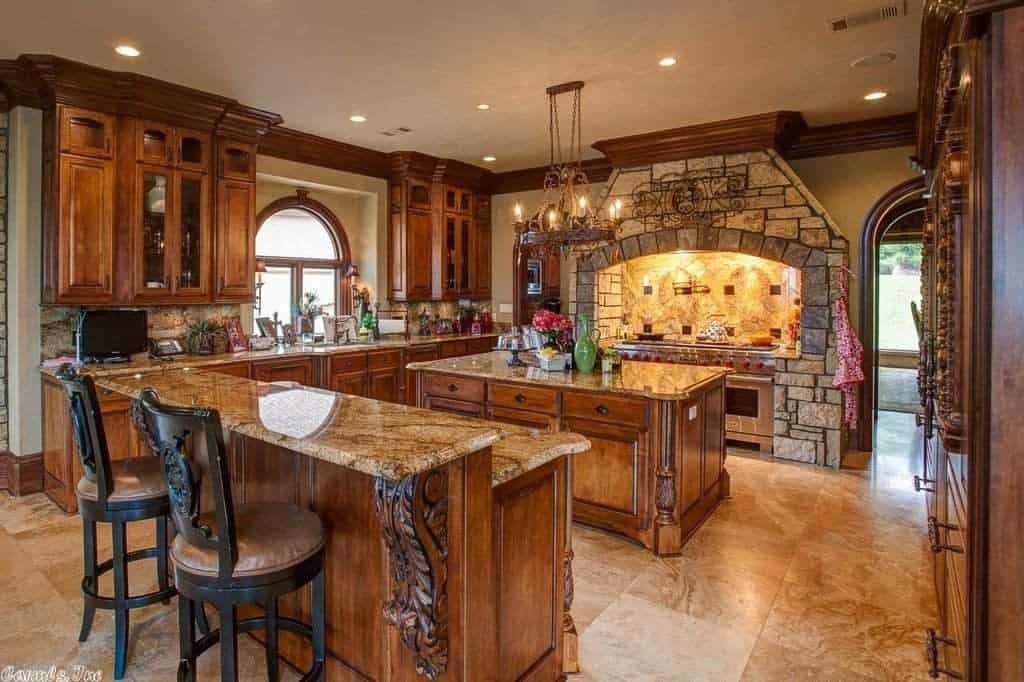Custom oak kitchen cabinets with a beautiful stone veneer cooking area