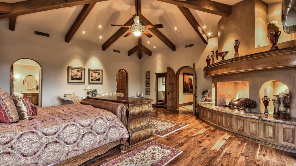 Mediterranean Master Bedroom with Carpet & Exposed beam