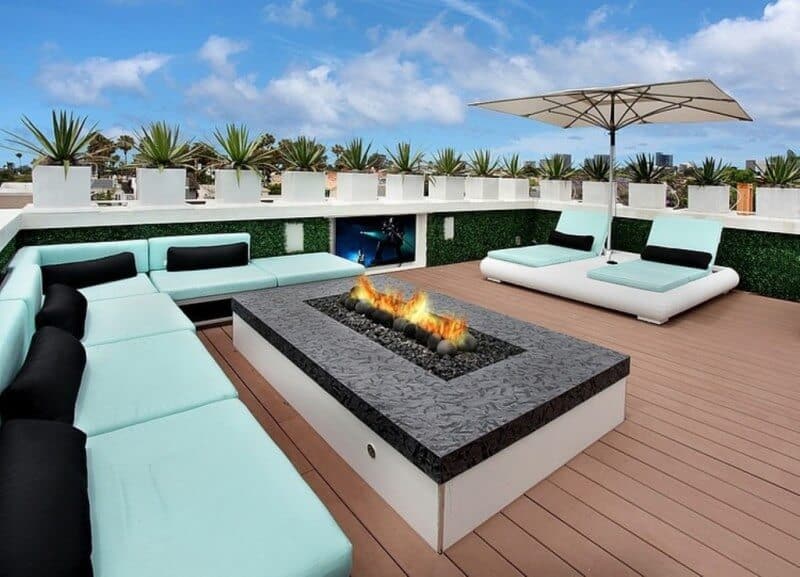 Flat roof top composite deck with a firepit