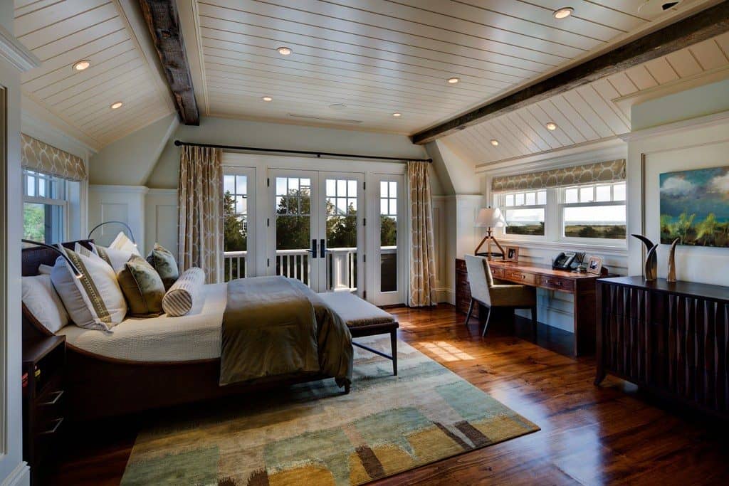 Cottage Master Bedroom with Carpet & Exposed beams