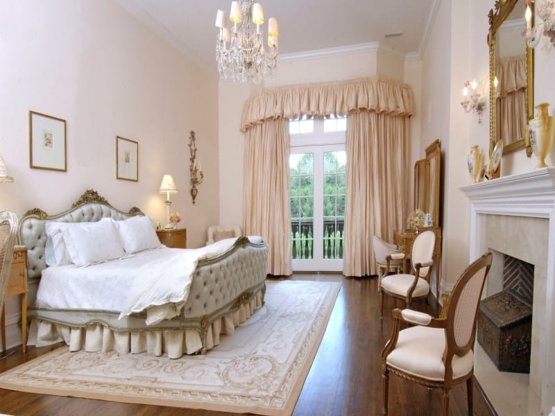 English style luxury master bedroom with fireplace 