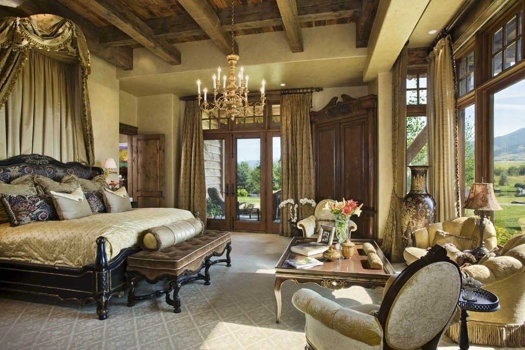 luxury master bedroom with exposed beams