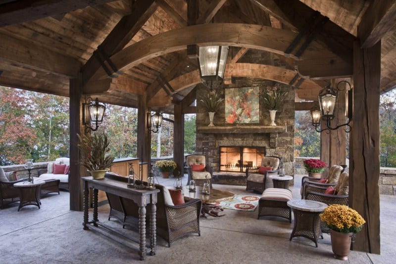 Beautiful rustic style patio with a pergoal and fire pit