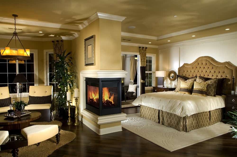 Traditional Master Bedroom with metal fireplace & Hardwood floors