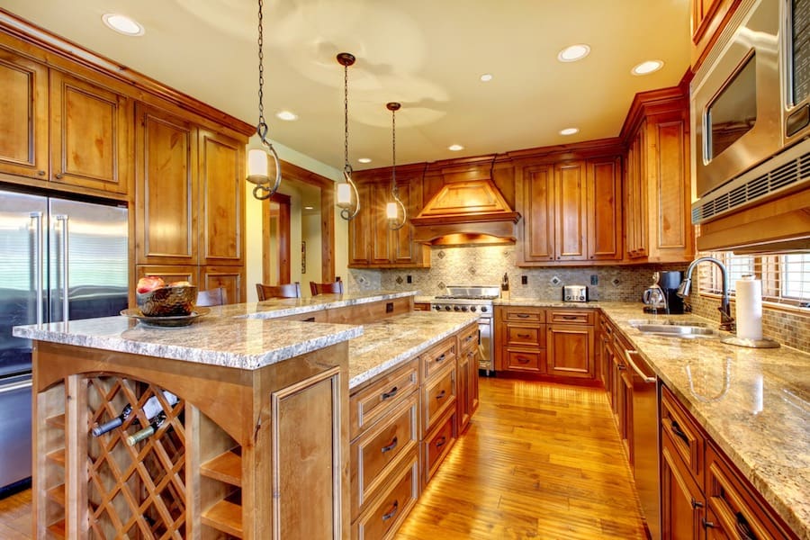  luxury home with wood kitchen and granite countertop.
