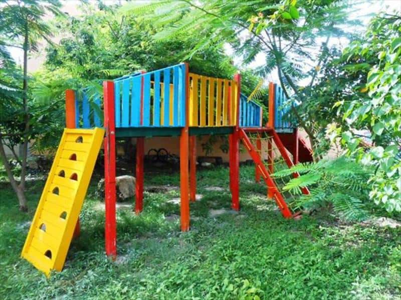 kids playground made of reclaimed wood