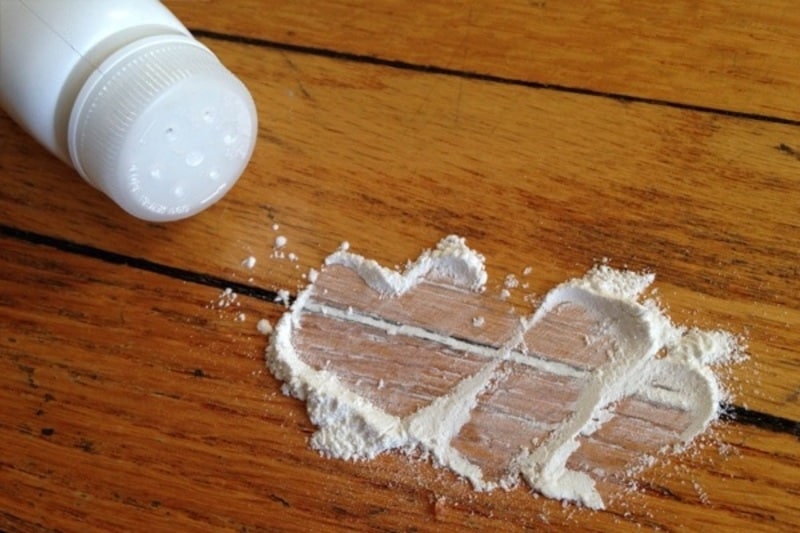 repair squeaky floor with baby powder