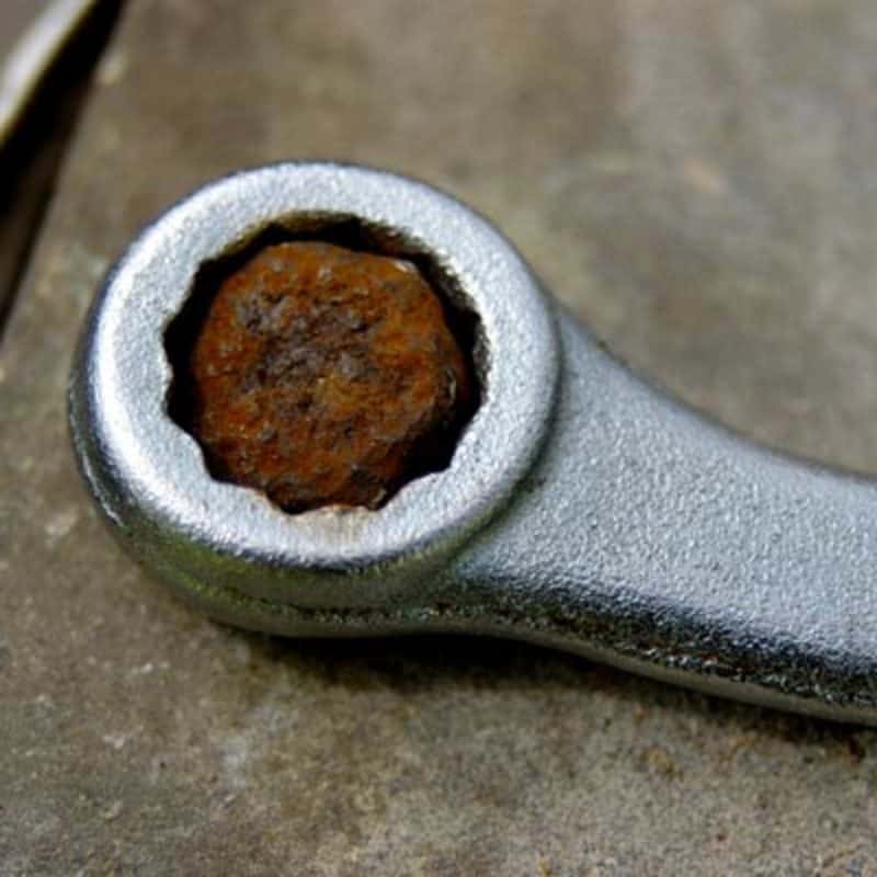 socket wrench to remove rusted nut